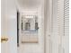 Hallway view with a bathroom and doors at 925 N Halifax Ave # 910, Daytona Beach, FL 32118