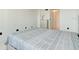 Bright bedroom with dresser and a view to the hallway at 925 N Halifax Ave # 910, Daytona Beach, FL 32118