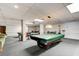 Spacious billiards room with multiple pool tables and ample seating for players and spectators at 925 N Halifax Ave # 910, Daytona Beach, FL 32118
