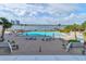 Community pool with lounge chairs and umbrellas overlooking the river and city, offering relaxing views at 925 N Halifax Ave # 910, Daytona Beach, FL 32118