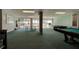 Expansive game room with a pool table, ping pong and views of the pool and ocean at 925 N Halifax Ave # 910, Daytona Beach, FL 32118