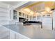 Kitchen with modern appliances, including glass front cabinets and breakfast bar, offering functionality at 925 N Halifax Ave # 910, Daytona Beach, FL 32118