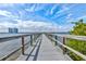 Picturesque wooden pier extending over the water, offering stunning views of the skyline and waterfront at 925 N Halifax Ave # 910, Daytona Beach, FL 32118
