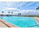 Sparkling blue outdoor pool with clear water and scenic views of the surrounding landscape at 925 N Halifax Ave # 910, Daytona Beach, FL 32118