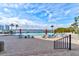 Inviting outdoor pool area with lounge chairs, tables, and umbrellas, ideal for relaxation and leisure at 925 N Halifax Ave # 910, Daytona Beach, FL 32118