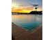 Close-up on community pool with calming waters with a view of the evening skies at 925 N Halifax Ave # 910, Daytona Beach, FL 32118