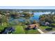 Gorgeous aerial view of a lakefront homes surrounded by lush trees at 951 Lovington Dr, Deltona, FL 32738