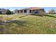 Backyard of home featuring green and brown lawn at 951 Lovington Dr, Deltona, FL 32738