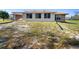 Backyard of home featuring green and brown lawn at 951 Lovington Dr, Deltona, FL 32738