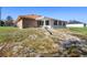 Backyard of home featuring green and brown lawn at 951 Lovington Dr, Deltona, FL 32738