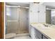 Clean bathroom featuring a tiled shower, vanity with counter space and modern fixtures at 951 Lovington Dr, Deltona, FL 32738