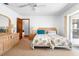 Inviting bedroom with neutral carpet, ceiling fan, and sliding glass doors at 951 Lovington Dr, Deltona, FL 32738