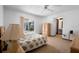Comfortable bedroom featuring neutral carpet, ceiling fan, sliding glass doors, and a spacious wardrobe at 951 Lovington Dr, Deltona, FL 32738