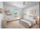 Cozy bedroom with a neutral palette, large window, and modern furnishings at 951 Lovington Dr, Deltona, FL 32738