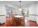 Cozy dining area featuring tile floors, white cabinets, and sliding glass doors at 951 Lovington Dr, Deltona, FL 32738