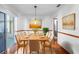 Elegant dining room with hardwood floors, a wooden table, and seating for ten at 951 Lovington Dr, Deltona, FL 32738
