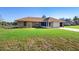 Charming single-story brick home with lush green lawn at 951 Lovington Dr, Deltona, FL 32738