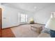 Bright living room with neutral carpet, white walls, ceiling fan, and large window at 951 Lovington Dr, Deltona, FL 32738