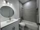 Updated bathroom featuring stylish tiles, new vanity, and a shower-tub combination at 951 Redwood St, Daytona Beach, FL 32117