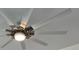 Close-up of modern ceiling fan featuring stylish blades, a light fixture, and a contemporary design element at 951 Redwood St, Daytona Beach, FL 32117