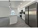 Eat-in kitchen with stainless steel appliances, island with sink, and gray wood-look flooring at 955 Redwood St, Daytona Beach, FL 32117