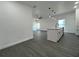 Bright, open kitchen with stainless steel appliances and gray wood-look flooring at 955 Redwood St, Daytona Beach, FL 32117