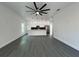 Bright, open-concept living space with modern finishes, sleek flooring, and a kitchen island with pendant lighting at 955 Redwood St, Daytona Beach, FL 32117