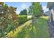 The backyard is beautifully landscaped with a lake view and lush greenery for privacy at 1079 Lincolnshire Dr, Deland, FL 32724