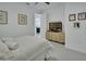 Bedroom featuring a cozy bed, dresser with television, and simple decor at 1079 Lincolnshire Dr, Deland, FL 32724