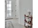 Bright entryway featuring tile floors, a stylish front door, and an accent shelf at 1079 Lincolnshire Dr, Deland, FL 32724