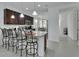 Open kitchen boasts granite countertops and dark wood cabinetry at 1079 Lincolnshire Dr, Deland, FL 32724