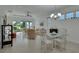 Bright living room featuring tile floors, chandelier, and a comfortable seating area at 1079 Lincolnshire Dr, Deland, FL 32724