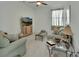 Comfortable living room with ceiling fan, television, and neutral decor at 1079 Lincolnshire Dr, Deland, FL 32724