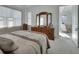 Bright and airy main bedroom with dresser and ensuite access at 1079 Lincolnshire Dr, Deland, FL 32724