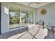 Covered patio with brick flooring, ceiling fan, and sliding glass doors overlooking the backyard at 1079 Lincolnshire Dr, Deland, FL 32724