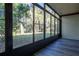Sunroom with large windows offering serene views of the surrounding landscape at 100 Sweetgum Woods Ct # 10C, Deltona, FL 32725