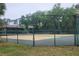 Enjoy a match on this tennis court, surrounded by lush greenery at 100 Sweetgum Woods Ct # 10C, Deltona, FL 32725