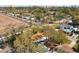 An aerial view of a single-Gathering home in a neighborhood with city views, mature trees, and a fenced backyard at 1002 Charles St, Port Orange, FL 32129