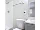 Modern bathroom featuring a white tiled shower and sleek gray vanity at 1002 Charles St, Port Orange, FL 32129
