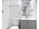 Updated bathroom with gray vanity, new fixtures, and a tiled shower at 1002 Charles St, Port Orange, FL 32129