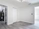 Bedroom boasts neutral walls, modern flooring, and a glimpse into a utility area at 1002 Charles St, Port Orange, FL 32129