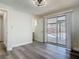 Bright room with sleek flooring, door, and sliding glass door to the yard at 1002 Charles St, Port Orange, FL 32129