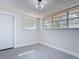 Bonus room with natural light streaming through the windows and a door leading outside at 1002 Charles St, Port Orange, FL 32129