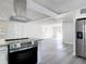 Open-concept kitchen with modern appliances flows seamlessly into the living area at 1002 Charles St, Port Orange, FL 32129