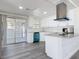 Bright kitchen features modern white cabinetry, granite countertops, and stainless steel appliances at 1002 Charles St, Port Orange, FL 32129