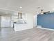 Bright, open-concept living space with a peninsula island bar to the modern kitchen at 1002 Charles St, Port Orange, FL 32129