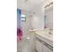 Bright bathroom with patterned shower curtain, neutral walls, and traditional vanity at 102 Underbrush Trl, Port Orange, FL 32128