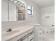 Bright bathroom featuring a soaking tub and a vanity with plentiful storage at 102 Underbrush Trl, Port Orange, FL 32128