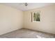 Cozy bedroom with wood-look floors and natural light from window at 102 Underbrush Trl, Port Orange, FL 32128