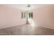 Bright bedroom with hardwood floors and large window at 102 Underbrush Trl, Port Orange, FL 32128